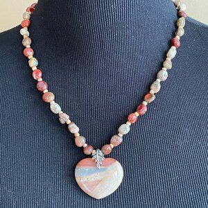 Polychrome heart-shaped pendant with polychrome nugget beads.